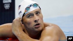 United States' Ryan Lochte checks his time in a men's 4x200-meter freestyle heat during the swimming competitions at the 2016 Summer Olympics, in Rio de Janeiro, Brazil, Aug. 9, 2016.