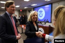 U.S. Secretary of Homeland Security Kirstjen Nielsen and Undersecretary Chris Krebs greet election security workers at the DHS Election Operations Center and the National Cybersecurity and Communications Integration Center in Arlington, Va., Nov. 6, 2018.