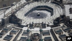 An aerial of the Grand mosque as Muslim pilgrims walk around the Kaaba, the black cube seen at center inside, during the annual hajj pilgrimage, in the holy city of Mecca, Saudi Arabia, Sept. 2, 2017. 