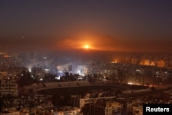 Smoke and flames rise after air strikes on rebel-controlled besieged area of Aleppo, as seen from a government-held side, in Syria December 11, 2016.
