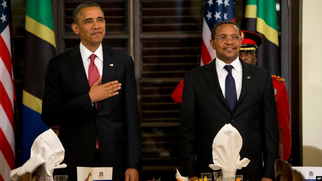 President Barack Obama and Tanzanian President Jakaya Kikwete stand for the national anthem during an official dinner at the State House in Dar es Salaam, Tanzania, July 1, 2013.