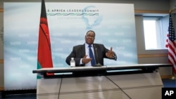 FILE - Malawi's President Peter Mutharika meets with reporters at the conclusion of the US-Africa Summit at the Institute of Peace in Washington in August.