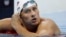 United States' Ryan Lochte checks his time in a men's 4x200-meter freestyle heat during the swimming competitions at the 2016 Summer Olympics, in Rio de Janeiro, Brazil, August 9, 2016.