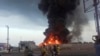 A large fire and plume of smoke is visible in the port city of Hodeida, Yemen, on Sept. 29, 2024, after Israeli strikes on the Houthi-controlled city. 