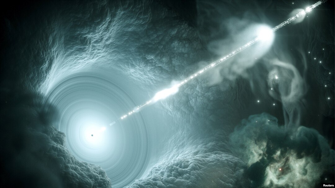 This artist's impression of the active galactic nucleus shows the supermassive black hole at the center of the accretion disk sending a narrow high-energy jet of matter into space, perpendicular to the disc in this image by Science Communication Lab in Kiel, Germany, released on July 12, 2018. In a study published in the journal Science, researchers have determined that a supermassive black hole like this one is the source of high-energy neutrinos detected on Earth.