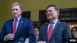 Cambodia National Rescue Party's President Kem Sokha, right, talks to the media as U.S. Ambassador to Cambodia W. Patrick Murphy listens after a welcoming meeting at Kem Sokha's house in Phnom Penh, Cambodia, Monday, Nov. 11, 2019.