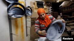 Carpenter-designer Asmaa Megahed, 30, is pictured in her workshop in Cairo, Feb. 27, 2017. Her message to other women is "that they shouldn't pay attention to those who comment negatively on the work traditionally for men, forget them. Women can do any business, no matter how difficult."