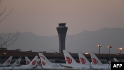 FILE - Air China planes are seen on the tarmac at Beijing Capital Airport in Beijing amid the ongoing COVID-19 coronavirus outbreak on March 13, 2020.