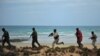 Somali security forces patrol along the coast of Qaw, in Puntland, northeastern Somalia, Dec. 18, 2016.