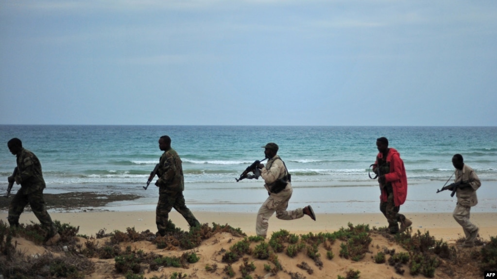 Somali security forces patrol along the coast of Qaw, in Puntland, northeastern Somalia, Dec. 18, 2016.