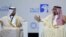 UAE Energy Minister Suhail al-Mazrouei, left, listens to Khalid al-Falih, Saudi Energy and Oil Minister, in the opening ceremony of the Abu Dhabi International Exhibition & Conference, ADIPEC, in Abu Dhabi, United Arab Emirates, Nov.12, 2018.