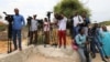 FILE - Somali journalists are seen during a stake-out on the outskirts of Mogadishu, Somalia, July 25, 2019.