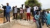 FILE - Somali journalists are seen during a stake-out on the outskirts of Mogadishu, Somalia, July 25, 2019.