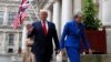 Britain's Prime Minister Theresa May and President Donald Trump walk through the Quadrangle of the Foreign Office for a joint press conference in central London, June 4, 2019.