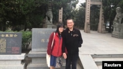 FILE - Chow Hang-tung and her fiance Ye Du pose for a photo in Huzhou City, Zhejiang province, China, Nov. 2018. (Handout via Reuters)