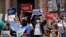 Demonstrators protest proposed voting bills on the steps of the Texas Capitol, July 13, 2021, in Austin, Texas.