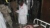 A student wounded during a suicide bomb attack at the College of Administrative and Business Studies receives treatment at a hospital in Potiskum Nigeria Friday, May 8, 2015. Suspected Boko Haram extremists attacked a business school in northeast Nigeria with gunfire and two bomb blasts. (AP Photo/Adamu Adamu)
