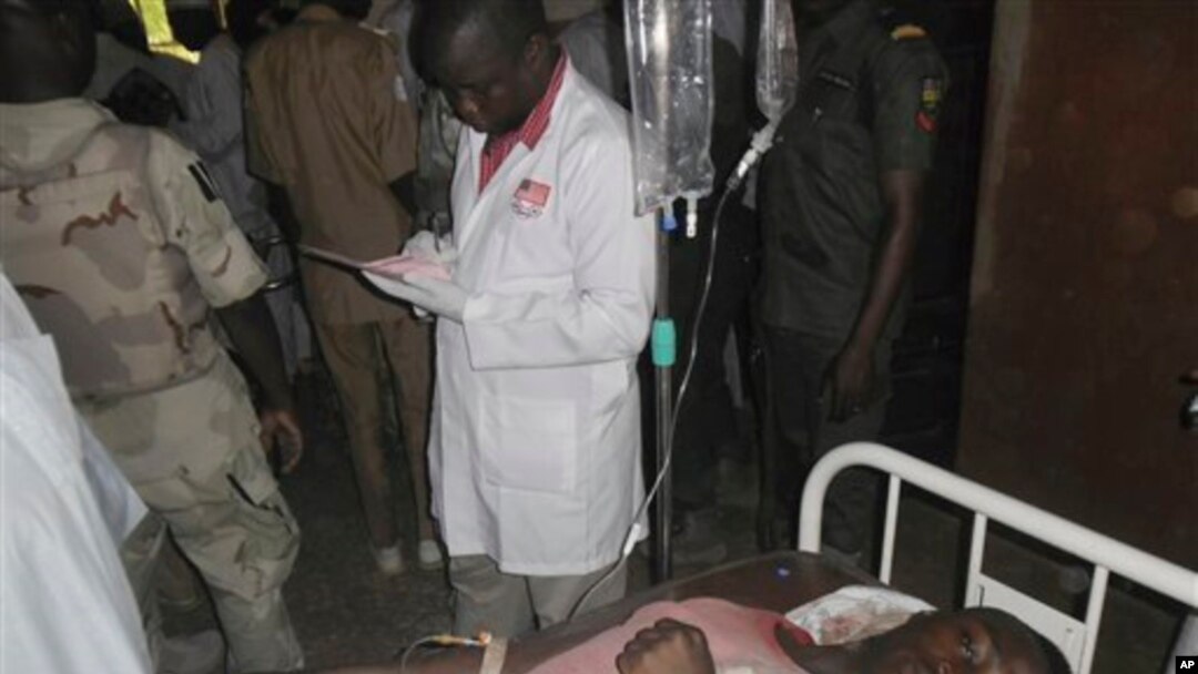 A student wounded during a suicide bomb attack at the College of Administrative and Business Studies receives treatment at a hospital in Potiskum Nigeria Friday, May 8, 2015. Suspected Boko Haram extremists attacked a business school in northeast Nigeria with gunfire and two bomb blasts. (AP Photo/Adamu Adamu)