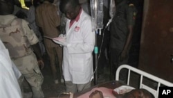 A student wounded during a suicide bomb attack at the College of Administrative and Business Studies receives treatment at a hospital in Potiskum Nigeria Friday, May 8, 2015. Suspected Boko Haram extremists attacked a business school in northeast Nigeria with gunfire and two bomb blasts. (AP Photo/Adamu Adamu)