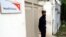 FILE - A security guard stands in front of the World Vision office in Mansehra, north of Islamabad, July 25, 2006. 