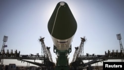 FILE - The Russian Progress-M spacecraft is ready to be lifted on its launch pad at Baikonur cosmodrome, Kazakhstan, July 1, 2015.