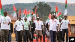 Current president Pierre Nkurunziza, center, arrives at the national conference for the ruling CNDD-FDD party in the rural province of Gitega, Burundi Sunday, Jan. 26, 2020.