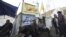 Protesters against Egypt's President Mohamed Morsi rest in front of a tent named "Revolution Party" at Tahrir Square in Cairo, December 17, 2012.