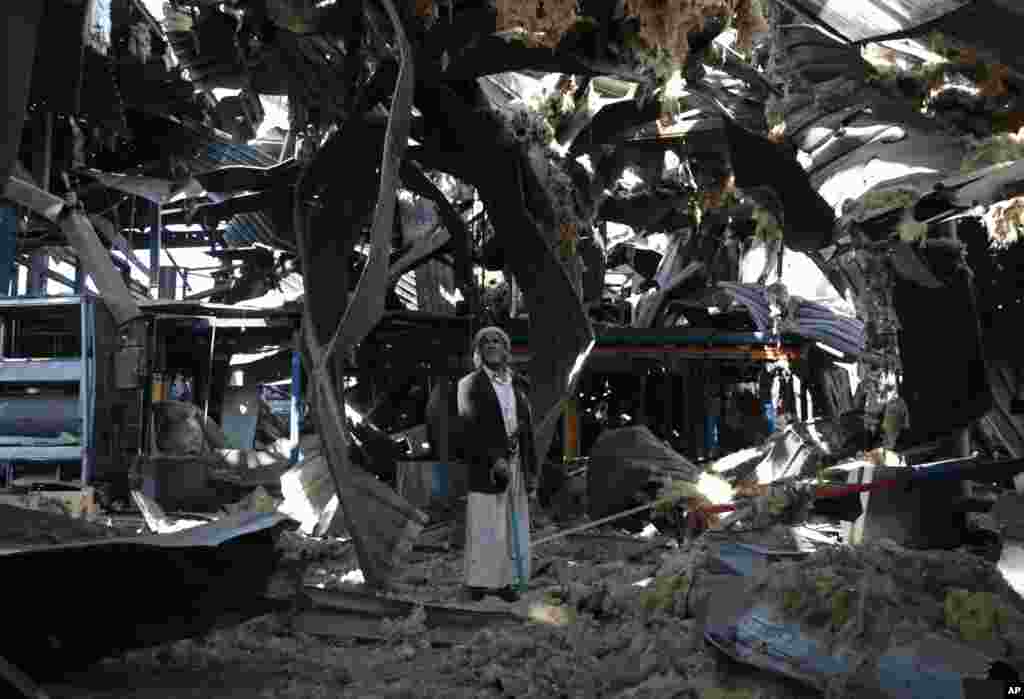 An elderly man stands among the rubble of the Alsonidar Group&#39;s water pump and pipe factory after it was hit by Saudi-led airstrikes in Sana&#39;a, Yemen.