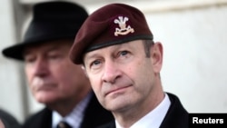 FILE - Then-UKIP leader Henry Bolton joins protesters from "Justice for Northern Ireland Veterans" as they demonstrate in Horse Guards Parade in Westminster in London, Feb. 3, 2018. 