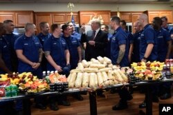 President Donald Trump meets with members of the U.S. Coast Guard stationed at United States Coast Guard Station Lake Worth Inlet in Riviera Beach, Fla., on Thanksgiving Day, Nov. 22, 2018.