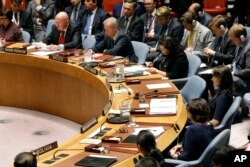 Russia's U.N. Ambassador Vassily Nebenzia, upper left, addresses the United Nations Security Council, as U.S. Ambassador Nikki Haley, right, listens at U.N. headquarters, Monday, Sept. 17, 2018.