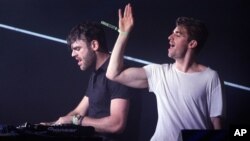 FILE - Andrew Taggart, right, and Alex Pall with the The Chainsmokers performs at the Bonnaroo Music and Arts Festival, June 10, 2016.