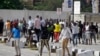 FILE - Young people protest at the Lekki Toll Gate in Lagos, Nigeria, Oct. 21, 2020. The Lekki gate was the site where demonstrators were fired upon earlier in the week in an escalation that sparked global outrage.