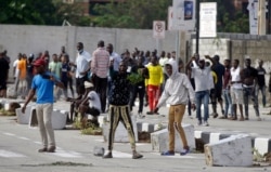 FILE - Young people protest at the Lekki toll gate in Lagos, Nigeria, Oct. 21, 2020.