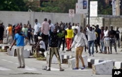 FILE - Young people protest at the Lekki Toll Gate in Lagos, Nigeria, Oct. 21, 2020. The gate was the site where demonstrators were fired upon earlier in the week in an escalation that sparked global outrage.