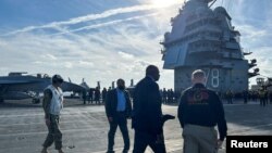 FILE - U.S. Secretary of Defense Lloyd Austin visits the aircraft carrier USS Gerald R. Ford in the eastern Mediterranean Sea on Dec. 20, 2023. Iran has threatened to "close" the Mediterranean because of the war in Gaza.
