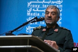 FILE - The head of Iran's paramilitary Revolutionary Guard, Gen. Mohammad Ali Jafari, speaks during a conference called "A World Without Terror," in Tehran, Oct. 31, 2017.