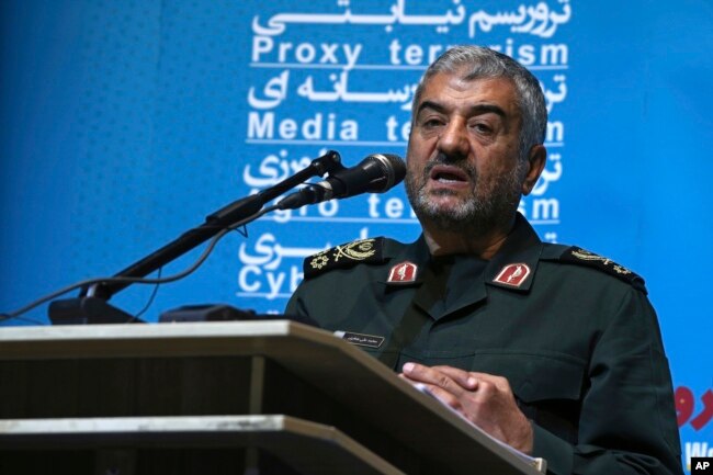 FILE - The head of Iran's paramilitary Revolutionary Guard, Gen. Mohammad Ali Jafari, speaks during a conference called "A World Without Terror," in Tehran, Oct. 31, 2017.