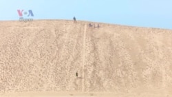 Michigan Sand Dunes Attract Tourists, Swallow Properties