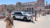 (FILE) Libyan Ministry of Interior personnel stand guard in front of the Central Bank of Libya in Tripoli, Libya, August 27, 2024. 