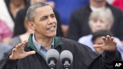 President Barack Obama speaks during a campaign stop in Council Bluffs, Iowa, August 13, 2012.