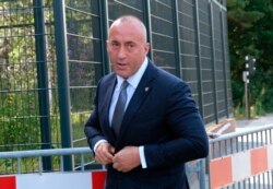 FILE - Former Kosovo Prime Minister Ramush Haradinaj arrives for a Kosovo tribunal, at the Hague, Netherlands, July 24, 2019.