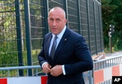 FILE - Former Kosovo Prime Minister Ramush Haradinaj arrives for a Kosovo tribunal, at the Hague, Netherlands, July 24, 2019.