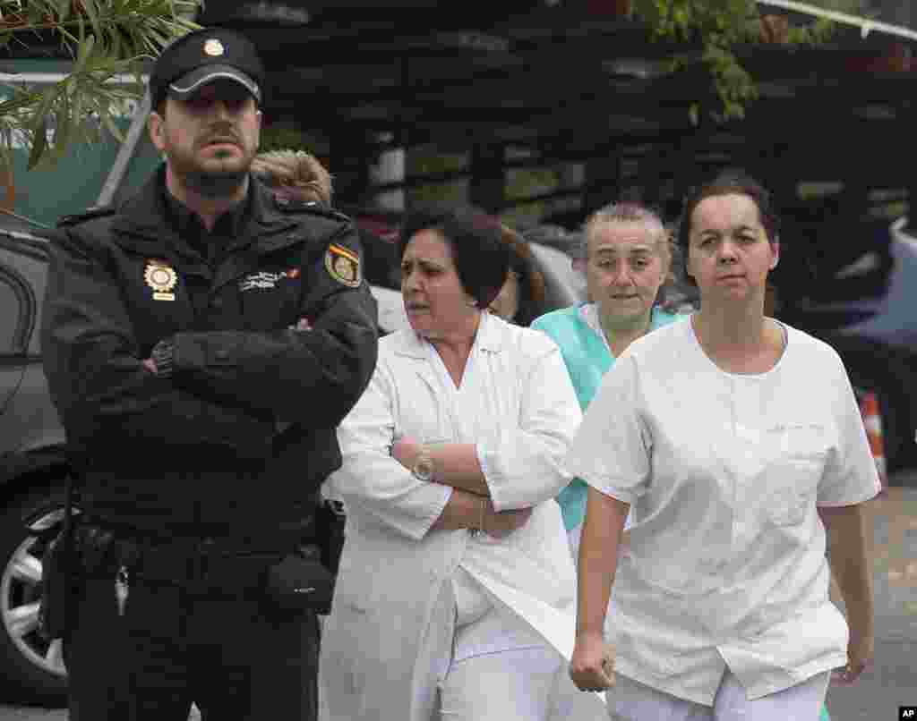 Hospital staff take part in a protest, demanding the resignation of Health Minister Ana Mato for the handling of a Spanish nurse who contracted the Ebola virus, outside Carlos III Hospital in Madrid, Spain, Oct. 7, 2014. 