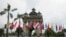 Flags of the 10-member ASEAN (Association of Southeast Asian Nations) and its dialogue partners are placed around the Patuxay Monument in downtown Vientiane, Laos, Sept. 5, 2016. 