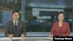 Opposition leader and former WBC heavyweight boxing champion Vitali Klitschko, center, is attacked and sprayed with a fire extinguisher as he tries to stop the clashes between police and protesters in central Kyiv, Ukraine.&nbsp;