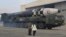 North Korean leader Kim Jong Un, left, and his daughter inspect what it says a Hwasong-17 intercontinental ballistic missile at Pyongyang International Airport in Pyongyang, North Korea, Nov. 18, 2022. Photo provided by the North Korean government, Nov. 1