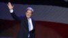 John Kerry waves as he walks to the podium to address the Democratic National Convention in Charlotte, North Carolina, September 6, 2012.