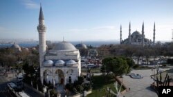 A view of the Sultan Ahmed Mosque, right, better known as the Blue Mosque in the historic Sultanahmet district of Istanbul, the area of an explosion, Tuesday, Jan. 12, 2016. The explosion killed several people and wounded more than a dozen others Tuesday morning in a historic district of Istanbul popular with tourists. Turkish President Recep Tayyip Erdogan said a Syria-linked suicide bomber is believed to be behind the attack.(AP Photo/Emrah Gurel)