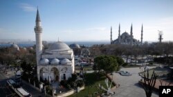 A view of the Sultan Ahmed Mosque, right, better known as the Blue Mosque in the historic Sultanahmet district of Istanbul, the area of an explosion, Tuesday, Jan. 12, 2016. The explosion killed several people and wounded more than a dozen others Tuesday morning in a historic district of Istanbul popular with tourists. Turkish President Recep Tayyip Erdogan said a Syria-linked suicide bomber is believed to be behind the attack.(AP/Emrah Gurel)